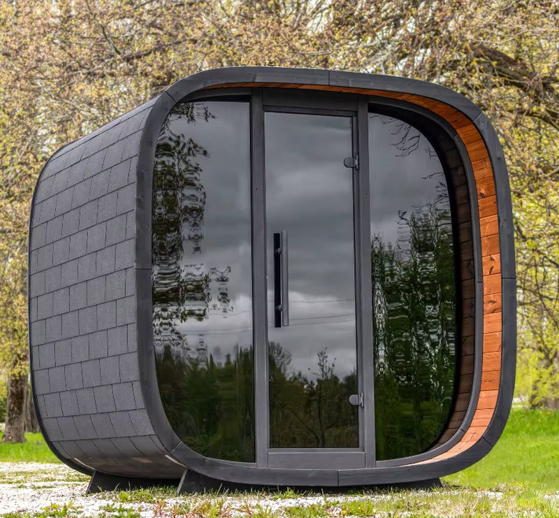 Modern outdoor pod with glass door in a natural setting